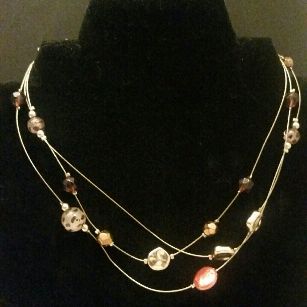Gold tone wire with leopard baubles